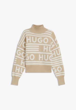 Beige striktrøje med høj hals, prydet med cremefarvede vandrette striber og "HUGO" gentaget i store blokbogstaver. Strikket tekstur, afslappet pasform.