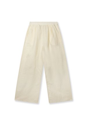 Pantalones de pierna ancha de color crema, de corte holgado, con cintura elástica y pliegues laterales, mostrados extendidos sobre un fondo blanco.