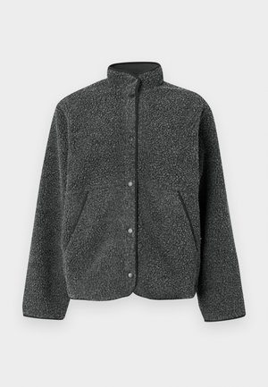 Tamsiai pilka vilnos striukė su aukštu apykakliu, spaudėmis ir šoninėmis kišenėmis. Audinys turi tekstūruotą, minkštą paviršių.