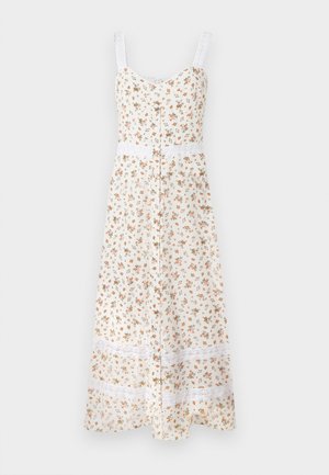 Floral midi dress in cream with adjustable spaghetti straps, button front, and white lace trim at the waist and hem. Features small orange and green flowers.