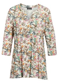 Bloemen tuniek met een V-hals, lange mouwen, met een mix van groene, roze en oranje patronen op een lichte achtergrond. Zachte, lichte stof.