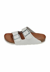 White slide sandal with two adjustable straps, silver buckles, cork midsole, and textured rubber outsole. Brown footbed with embossed logo.