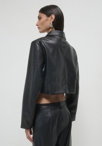 Calliope CHIODO - Giacca in similpelle - nero