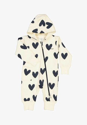 Kræmfarvet onepiece med hætte, prydet med et mønster af sorte hjerter, frontlynlås og ribbede manchetter. Blødt bomuldsstof med lommer.