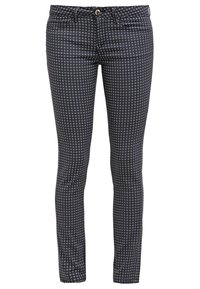 Mörkblå mönstrade jeans med en slim fit-design, försedda med ett diamantmönster, fem fickor och en enda guld-färgad knapp i midjan.