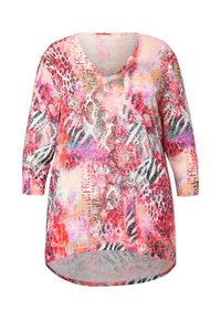 Mehrfarbige Tunika mit V-Ausschnitt, versehen mit einer Mischung aus Pink, Rot, Lila und Tiermotiven sowie einem asymmetrischen Saum. Weiches Material.