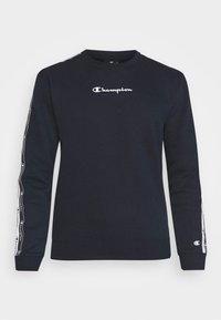 Sudadera negra de algodón con cuello redondo. Presenta el logo blanco de "Champion" en el pecho y cinta con el logo a lo largo de las mangas.