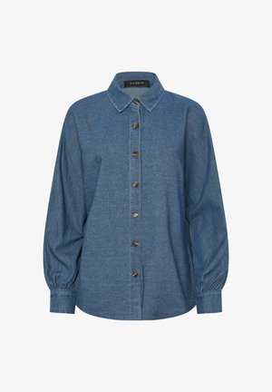 Chemise bleue à manches longues boutonnée, col pointu, poignets froncés et sept boutons marron sur le devant, étiquetée "Pixie Girl."