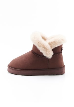 Brown winter ankle boot with thick cream-colored fur lining folded over the top and a flat sole on a white background.