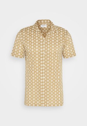 Kortärmad skjorta i beige med blommönster i vitt. Tillverkad av lättviktig tyg, med klassisk krage och knäppning framtill.