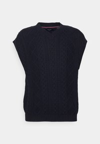 Gilet en maille bleu marine avec un col en V, présentant un motif en losange texturé et un ourlet côtelé. Manches courtes et coupe décontractée.