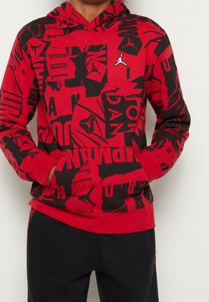 Red hoodie with black graphic patterns and a small white logo on the chest. Features a kangaroo pocket and a drawstring hood.