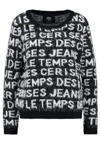 Pull en noir et blanc flou avec un texte audacieux dans des couleurs contrastées, col rond et poignets et ourlet côtelés.