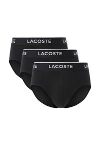 Zwarte katoenen boxershorts met een contrasterende witte Lacoste-logo tailleband. Beschikt over een aangesloten ontwerp en een gladde textuur, geschikt voor dagelijks gebruik.
