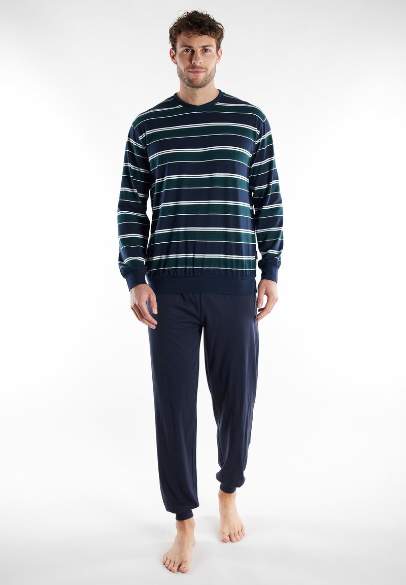 Navy and striped long-sleeve top with elastic cuffs, paired with navy drawstring pants. Casual cotton blend, lightweight, relaxed fit.