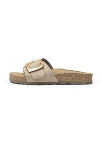 Beige suede slide sandal with a wide strap, featuring a gold square buckle and a textured cork footbed, set on a thick rubber sole.