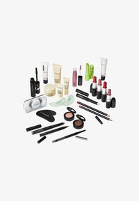 Assorted makeup products, including lipsticks, mascara, eyeliners, and skincare items in various containers, mainly black and clear.