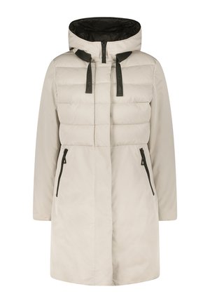 Manteau rembourré beige clair avec une capuche, présentant une section supérieure matelassée, un intérieur noir et deux poches zippées à l'avant.