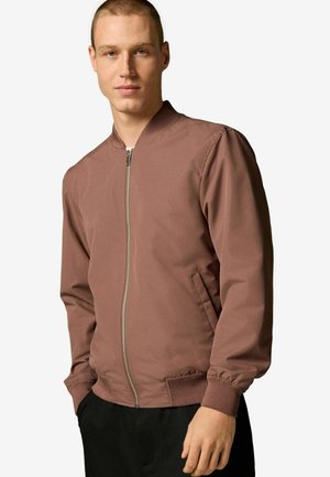 Brown bomber jacket with a front zipper, ribbed cuffs, and side pockets, made from smooth fabric with a slightly glossy finish.