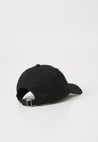 Black baseball cap made of cotton, featuring a curved visor, adjustable strap at the back, and a smooth texture. No patterns or accents.