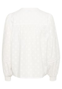 Witte blouse met een gemêleerd bloemmotief, lange, opbollende mouwen en fijne kantafwerking langs de manchetten. Ronde hals met een geplooide achterzijde.