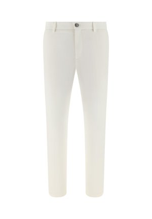 Pantalones ajustados de color crema con presillas para cinturón y cierre de botón negro en la cintura, mostrados sobre un fondo blanco.