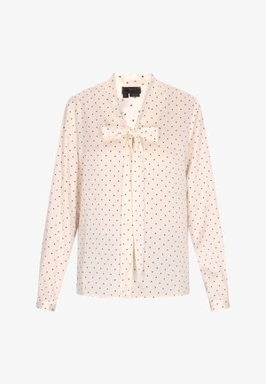 Kreemita blouse mustade täppidega, pikkade varrukatega ja kaeluses lipsude detailiga. Pehme kangas siledaga tekstuuriga.