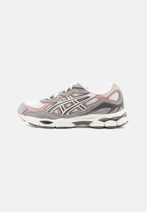 Running shoe with a gray and pink upper, mesh panels, white accents, and a thick, cushioned sole. Features laces and distinct brand logo.