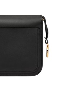 Black leather crossbody bag with a flat design, gold hardware, and a small logo tag. Features a smooth texture and clean stitching.
