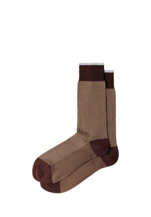Pair of brown patterned crew socks with dark brown heels, toes, and cuffs, featuring a subtle zigzag design on the main body.