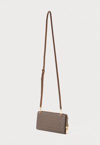 Brown designer clutch with a textured monogram pattern, gold hardware, and a detachable strap for crossbody or handheld use.