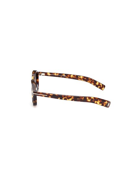 Brýlové obroučky v želvovinovém designu s mohutným rámem, čtvercovým tvarem a hladkým povrchem. Rámečky mají na stranách výrazný vzor s špičatými konci.