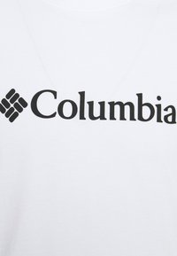 Hvid bomulds T-shirt med et stort sort "Columbia" logo. Glat tekstur med rund halsudskæring, designet til afslappet brug.