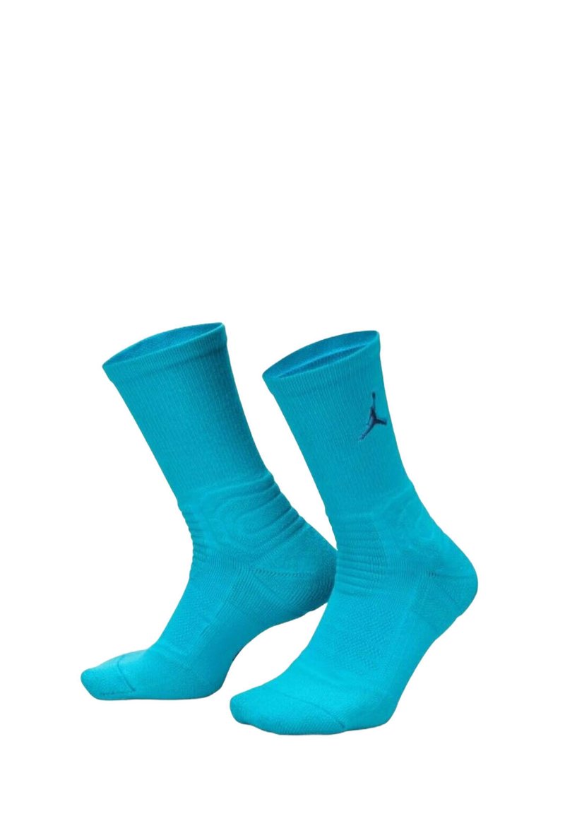Calzini sportivi turchesi con texture a coste, con tallone e punta rinforzati. Presenta un logo Jordan nero sul lato superiore.