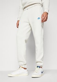 Nike Sportswear Träningsbyxor - beige