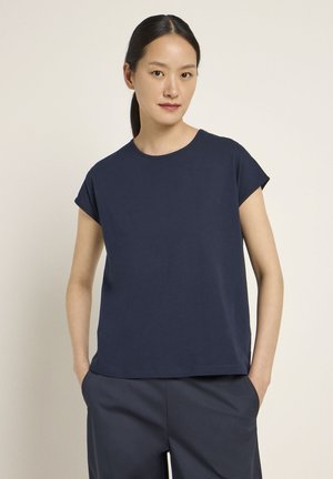 Navy blue short-sleeve T-shirt made of soft fabric, featuring a round neckline and a relaxed fit, paired with navy wide-leg trousers.