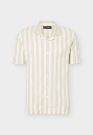 Short-sleeve, beige and white vertical striped button-up polo shirt with a folded collar.