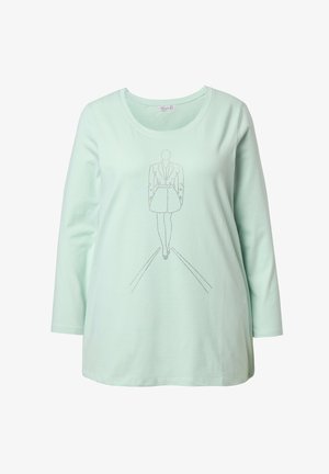 Camiseta de manga larga en verde menta con escote redondeado, que presenta un gráfico lineal y texturizado de una figura con vestido.