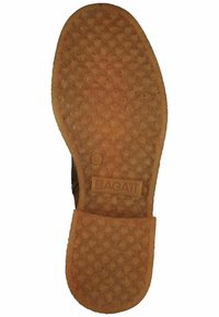 Rubberen loopzool met een gestructureerde grip, oranje van kleur, met de imprint "BAGATT" nabij de hiel. Rondom een flexibele vorm.