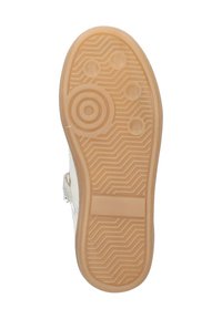 Semelle de chaussure en caoutchouc brun clair avec motifs circulaires et hexagonaux, surface texturée et bande centrale lisse.