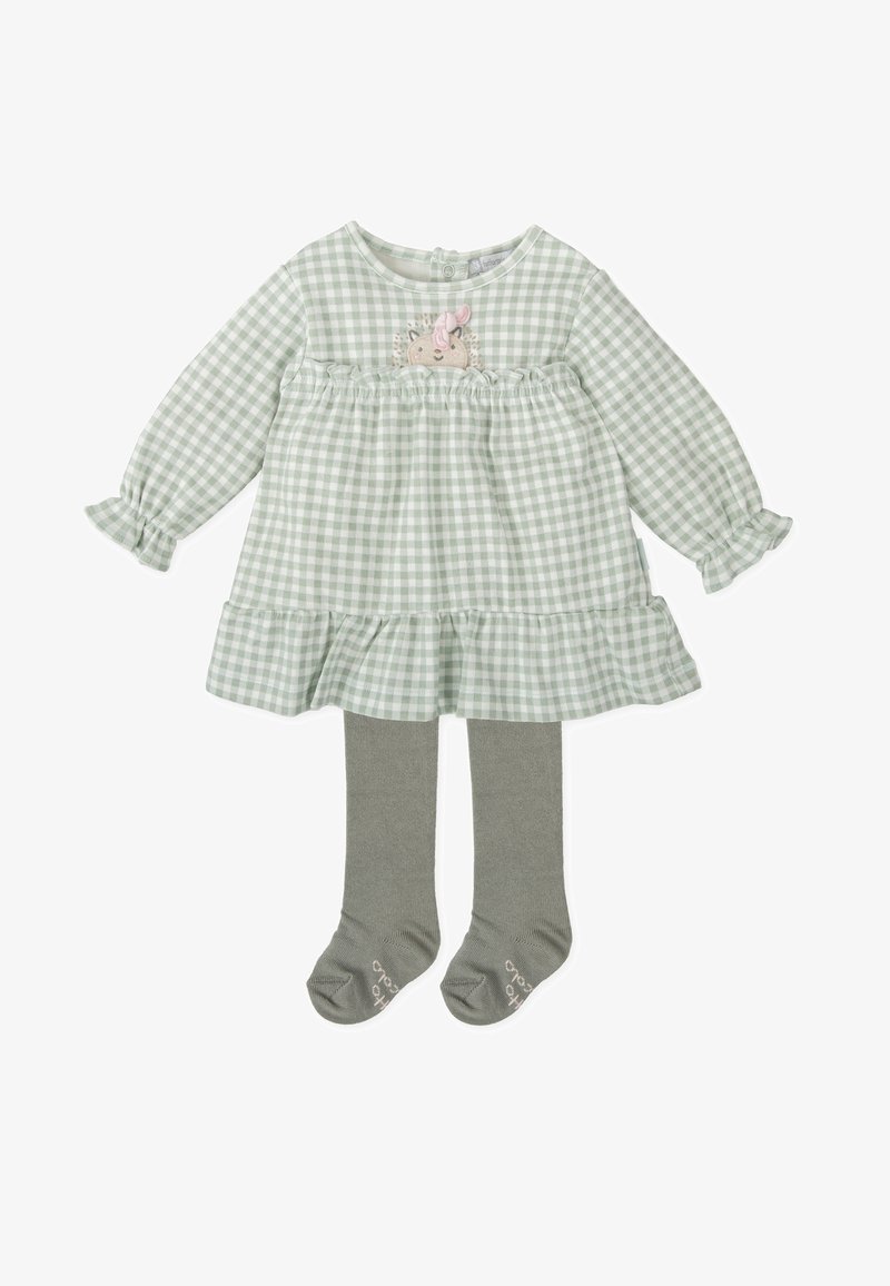 Robe à carreaux verts et blancs avec des manches longues, des détails à volants, un imprimé de hérisson, accompagnée de collants gris et de chaussettes assorties.