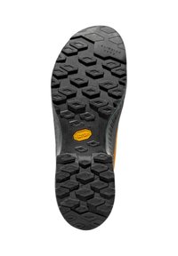 Klatringssula med en svart gummiyta som har hexagonala och diamantmönster, samt en framträdande orange Vibram-logotyp nära hälen.