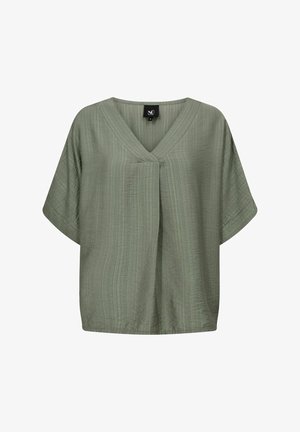 Žalias, trumpomis rankovėmis viršus su V formos iškirpte, pagamintas iš tekstūruoto audinio ir turintis laisvą siluetą. Pasižymi centriniu priekiniu raukiniu ir siūtu kraštu.