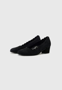Black suede low-heeled shoes with scalloped edging, rounded toe, and cushioned insole. Features a textured interior design.