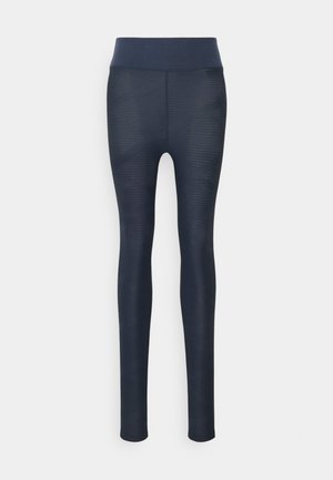Leggings azul-marinho com um padrão texturizado, cintura alta e um acabamento suave, projetados para conforto e flexibilidade nos movimentos.