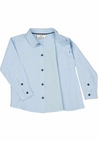 Ljusblå knäppskjorta gjord av mjukt, vävt tyg. Har långa ärmar, en krage och mörka knappar med kontrasterande sömmar.