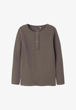 Brown long-sleeve ribbed shirt with a rounded neckline, snap button placket, and a small horizontal stitch detail at the base.
