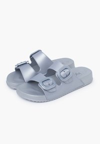 Gray slide sandals with two adjustable straps featuring square buckles. Made of smooth material with a textured footbed and rubber sole.