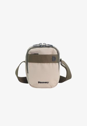 Kompakte beige-olivfarbene Umhängetasche mit verstellbarem Riemen, Frontreißverschlusstasche und "Discovery"-Logo auf der Vorderseite.