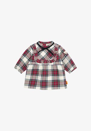 Robe à carreaux à manches longues, avec un col à volants et une taille froncée. Couleurs comprenant des carreaux rouges, bleu marine et blancs. Tissu doux.